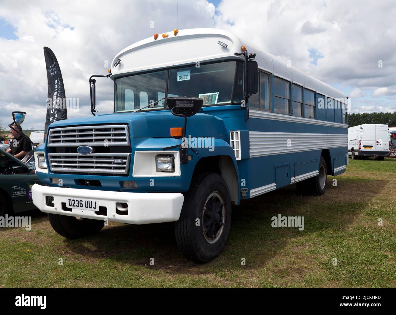 Three-quarters front view of a Sixth Generation, Blue and White, 1987, Ford  B Series, School Bus, on display at the Deal Classic Car Show 2022 Stock Photo
