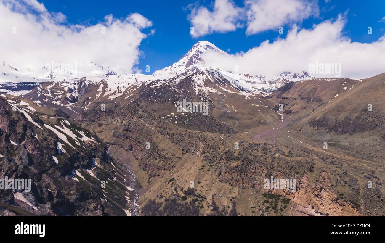 scenic view of snowcapped mountains Mkinvartsveri, Kazbegi, Georgia. beautiful nature. High quality photo Stock Photo