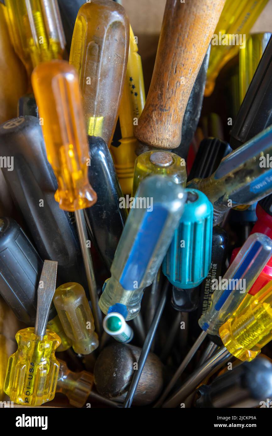 A jumble of screwdrivers in a workshop. Stock Photo