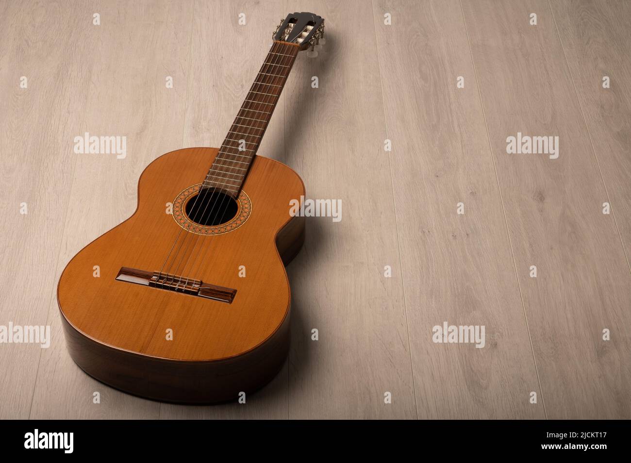 Classical guitar on a grey background with negative space for copy Stock Photo