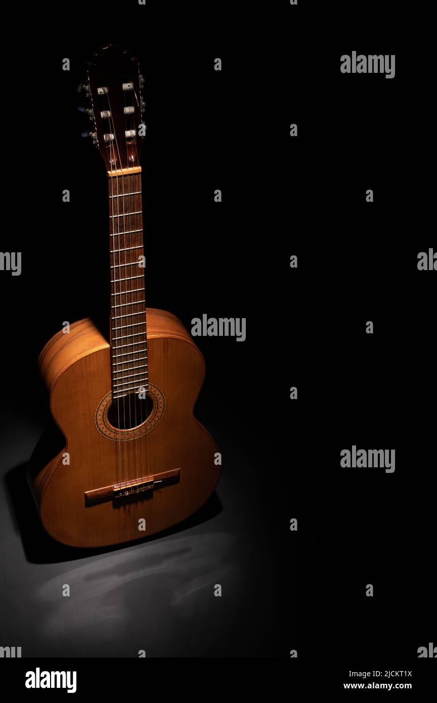 Classical guitar on a black background with negative space for copy Stock Photo