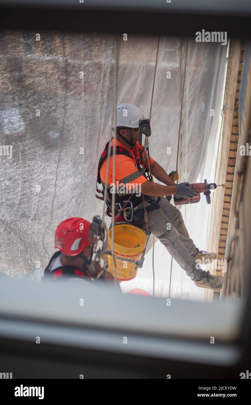 Climber hanging from ropes hi-res stock photography and images - Alamy