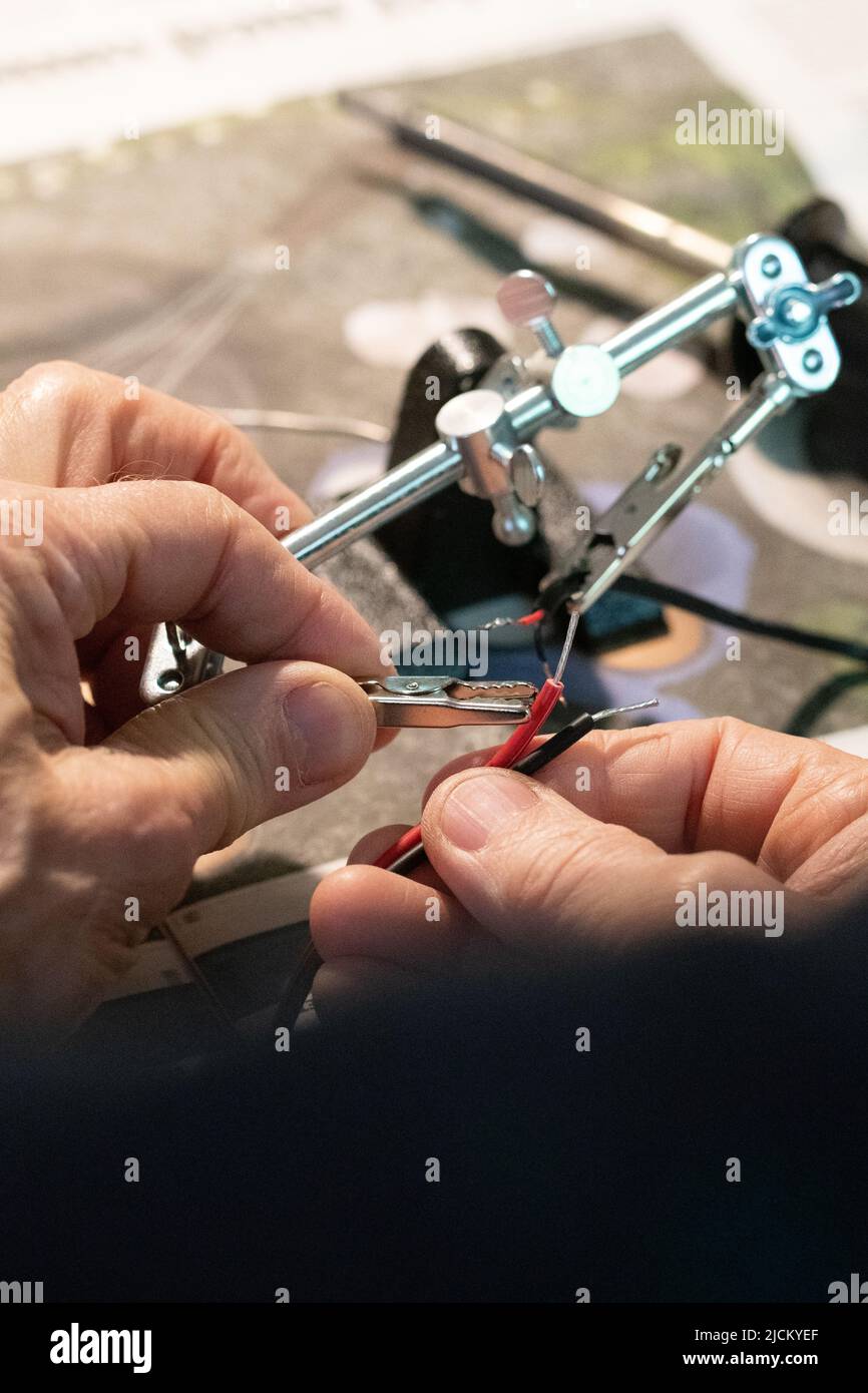 Closeup of macro of a man doing electricity work or putting wires