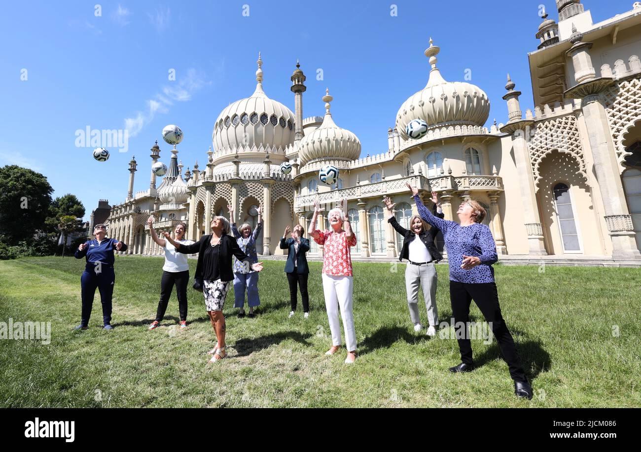 Brighton, UK. 14th June, 2022. Goal Power Women's Football 1894-2022 Exhibition launch outside the Royal Pavillion in Brighton. L-R Chris Lockwood, Maggie Murphy, Rose Reilly, Leah Caleb, Kelly Simmons, June Jaycocks, Gill Sayell and Eileen Bourne Credit: James Boardman/Alamy Live News Stock Photo