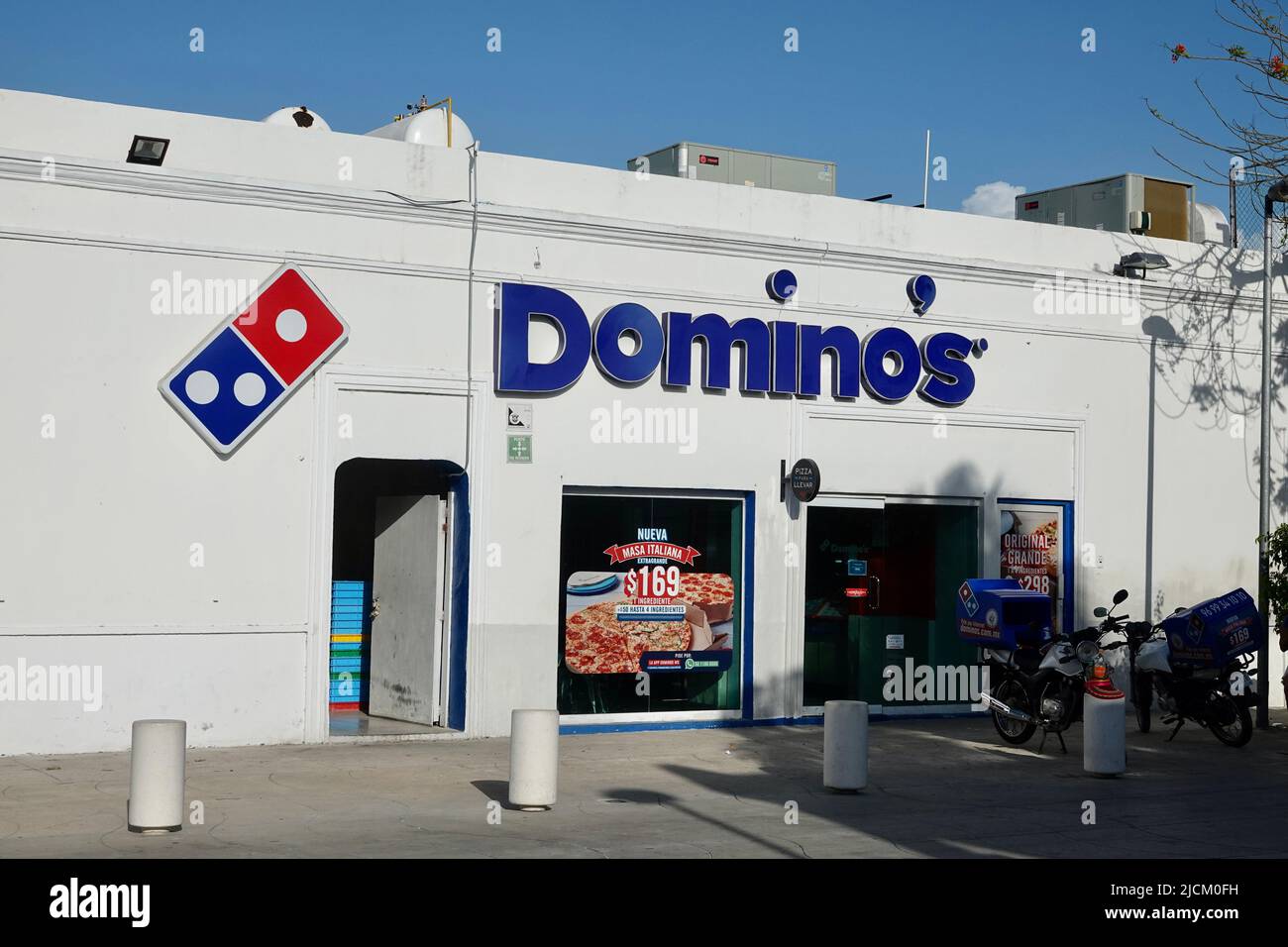 Progreso, Mexico - May 5 2022: A Domino's Pizza, also branded just as Domino's, is an American pizza chain restaurant with headquarters in Ann Arbor Stock Photo