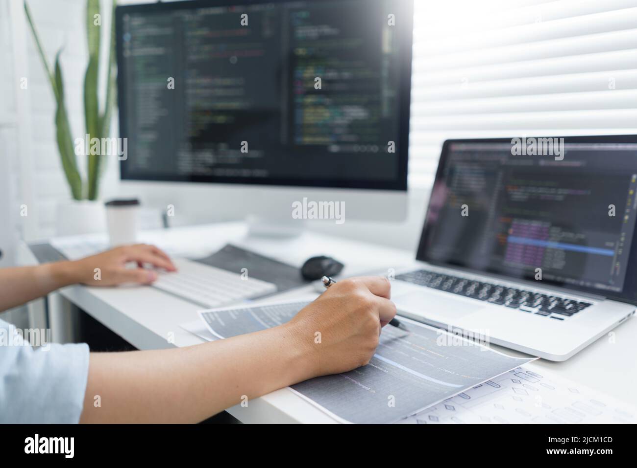 Software development concept, Male programmer pointing on data code to ...