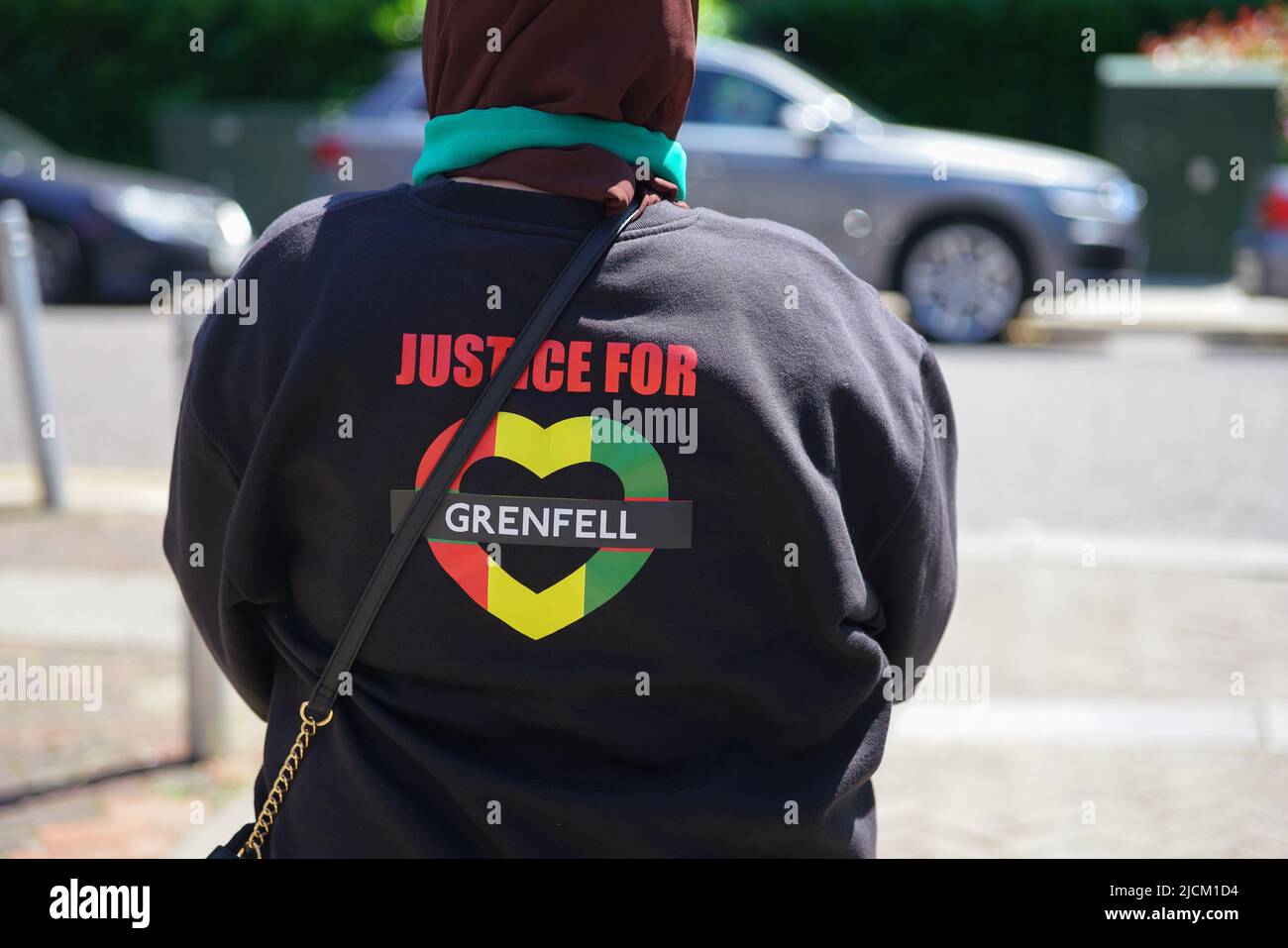 June 14th, Grenfell Tower, London, UK. The June 2017 disaster, which caused the deaths of 72 people, has left residents living in its shadow still feeling the emptiness and pain of the tragedy, five years on. PICTURED: The 'Justice for Grenfell' logo on a garment. Credit: Bridget Catterall/Alamy Live News. Stock Photo