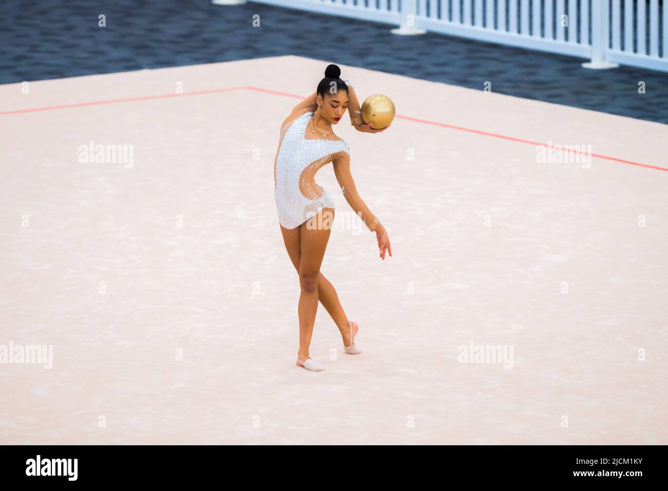 Australian Senior International Rhythmic Gymnast, Ashari Gill, starting  pose of a hoop routine during 2022 Oceania Rhythmic Gymnastics Continental  Championships. The event was running in parallel with Australian Gymnastics  Championships on Gold