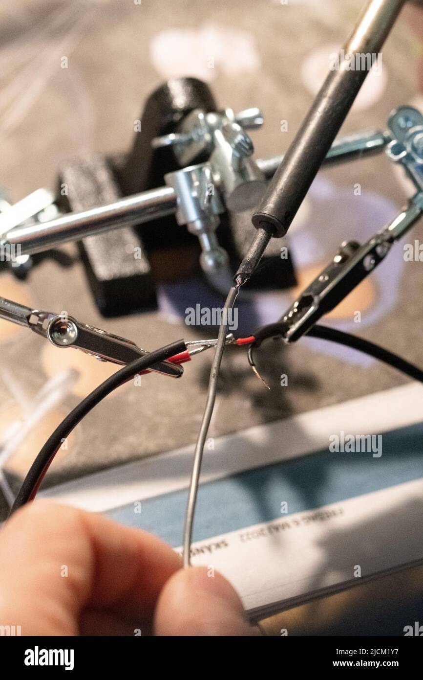 Closeup of macro of a man doing electricity work or putting wires