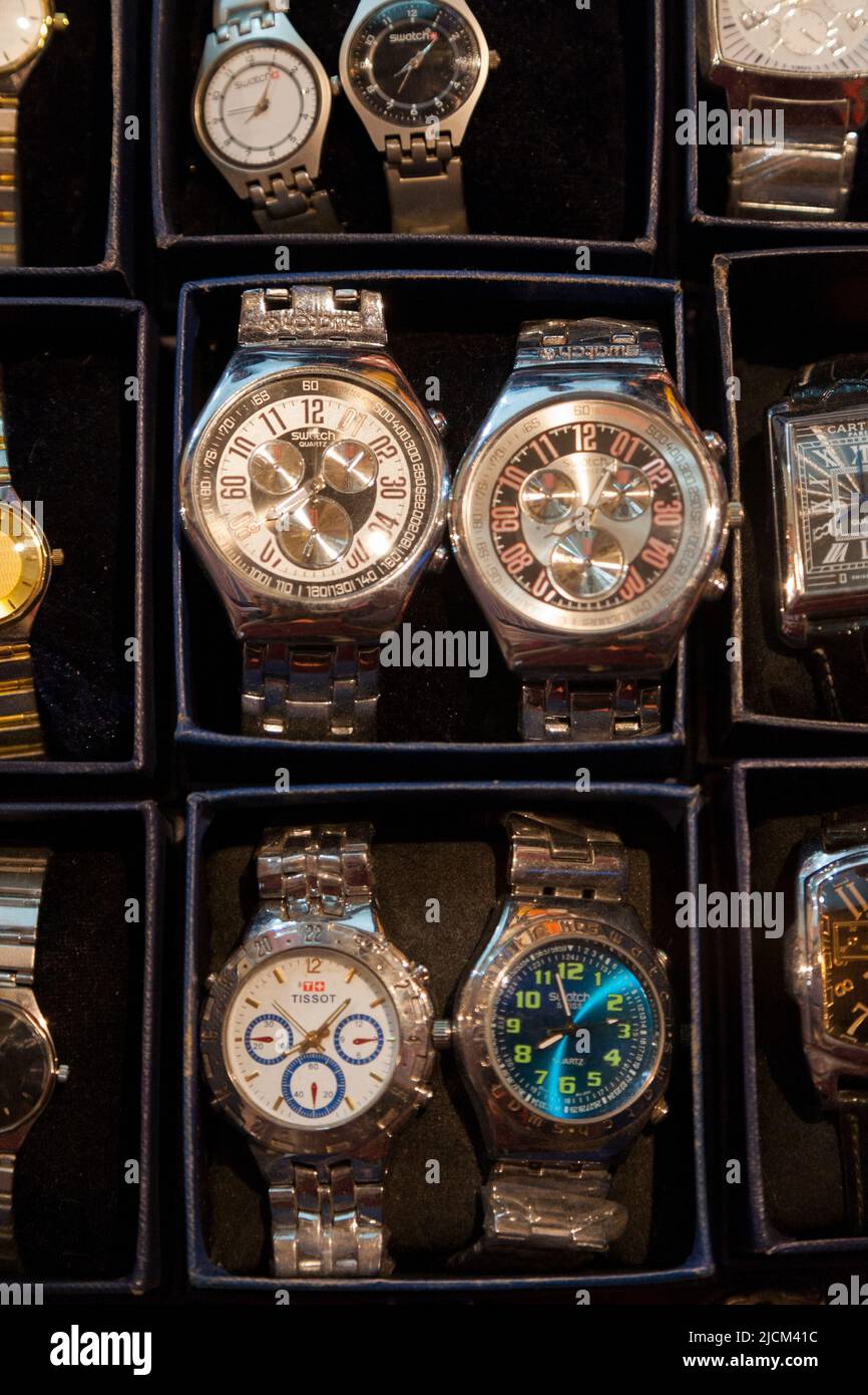 Counterfeit goods, watches faking manufacture by expensive watch manufacturers, for sale on a market stall in Xi'an in China. (125) Stock Photo