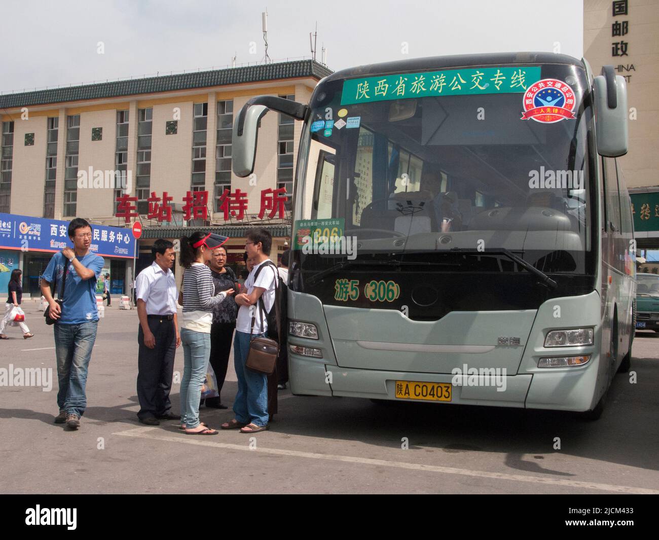 Bus Number 306 / buses / coach / coaches waiting for passengers to embark before commencing travel from bus station stop in the City of Xi'an, PRC, China. (125) Stock Photo