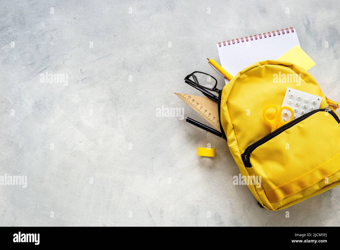 School bag with with colorful school items, top view Stock Photo - Alamy