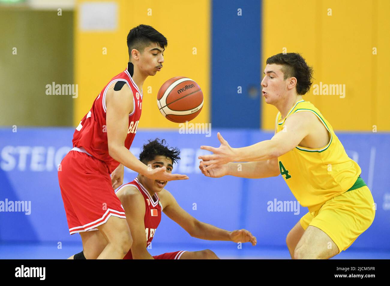 Doha, Qatar - 14 June 2022, Mohamed Ramadhan (L) of Bahrain Basketball team  and Kristian Ferronato (R) of Australia Basketball team in action during  the 2022 FIBA U16 Asian Championship match between