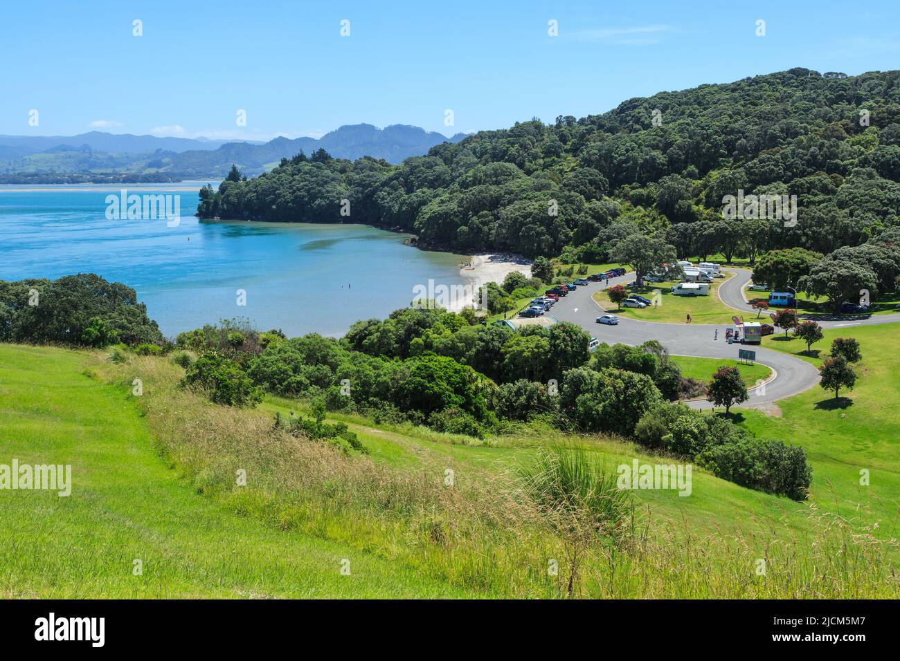 Anzac Bay, a popular summer destination at Bowentown, New Zealand. View of the beach and freedom camping area Stock Photo