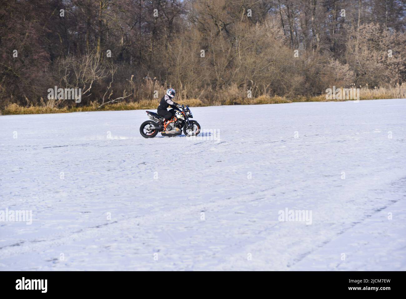 Motorbike ice rink on the frozen river Stock Photo Alamy