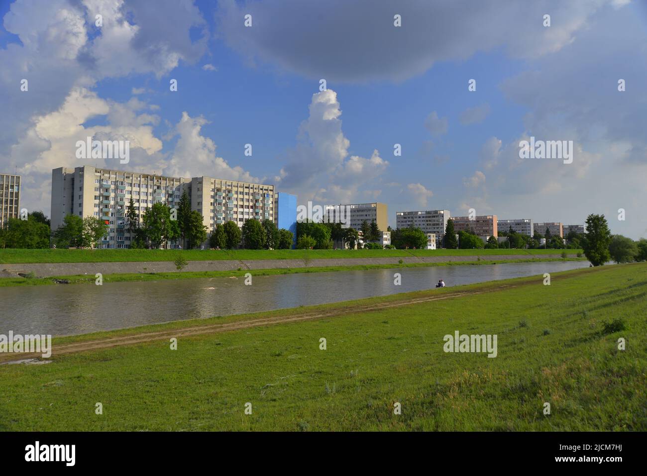 Cumulus nimbus clouds over the Mures river Stock Photo