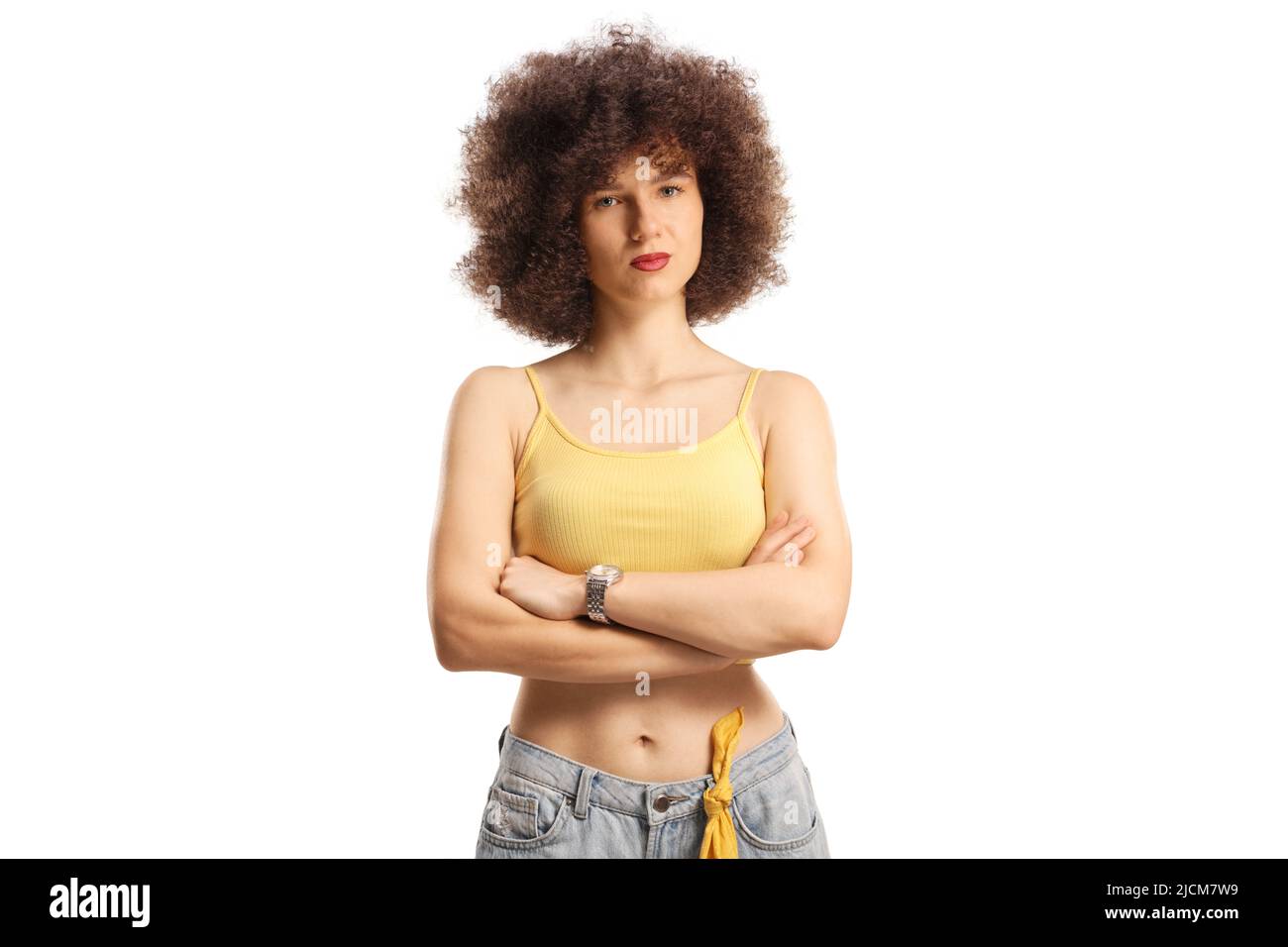 Serious young caucasian woman with afro hairstyle isolated on white background Stock Photo