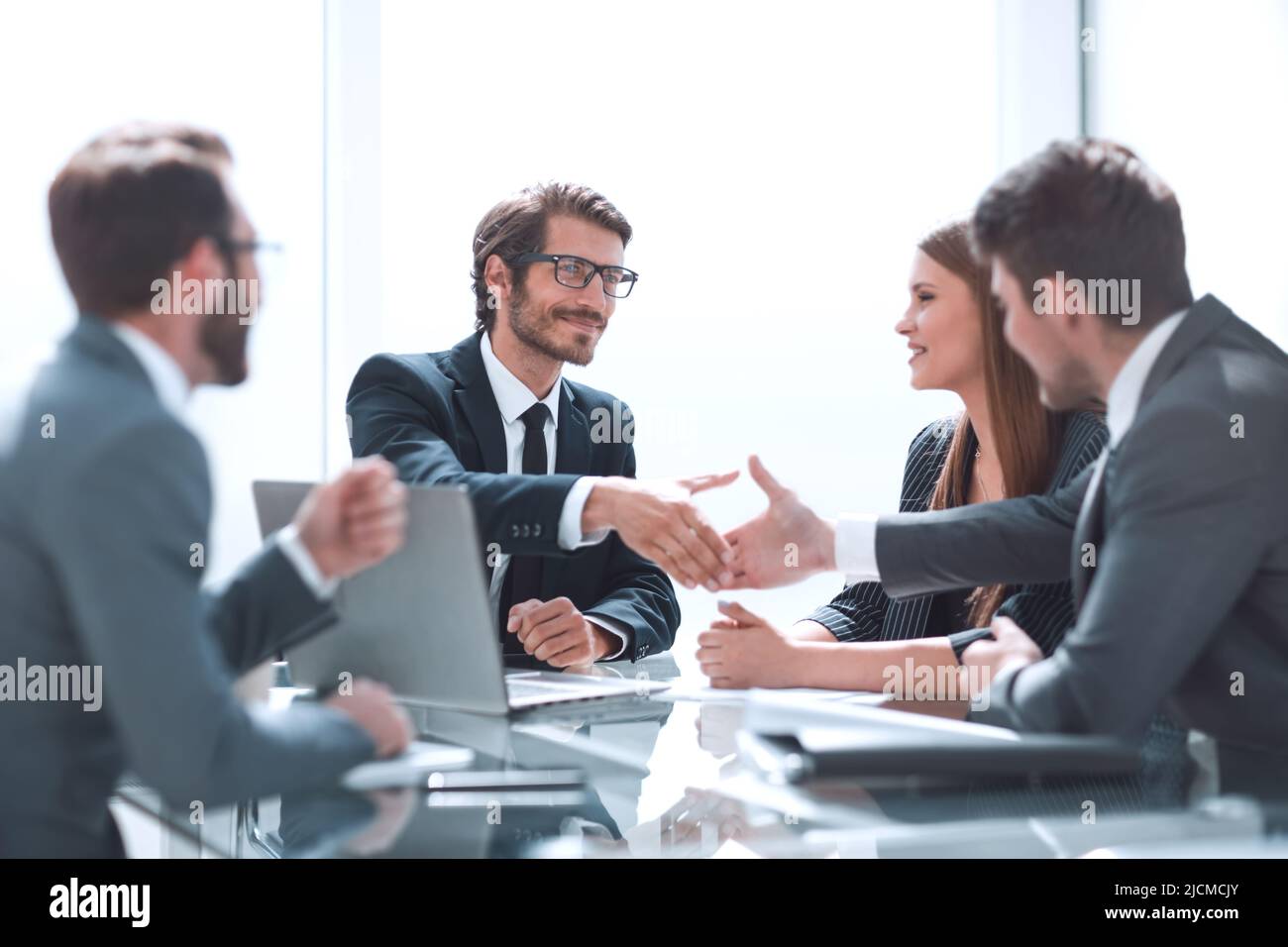 business partners reach out to each other for a handshake Stock Photo