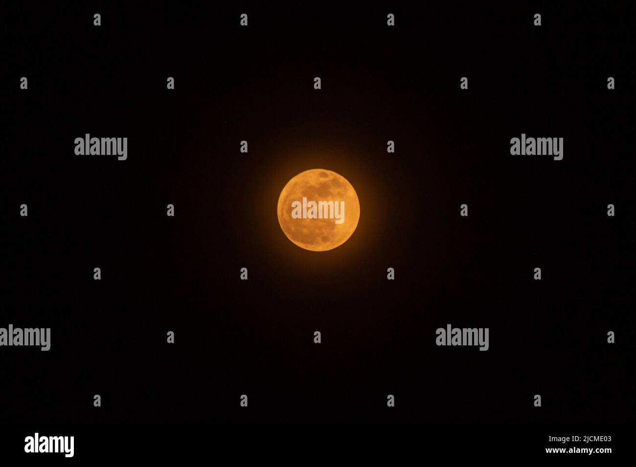 Strawberry Moon rises over the sky after the heavy rainfall. June's