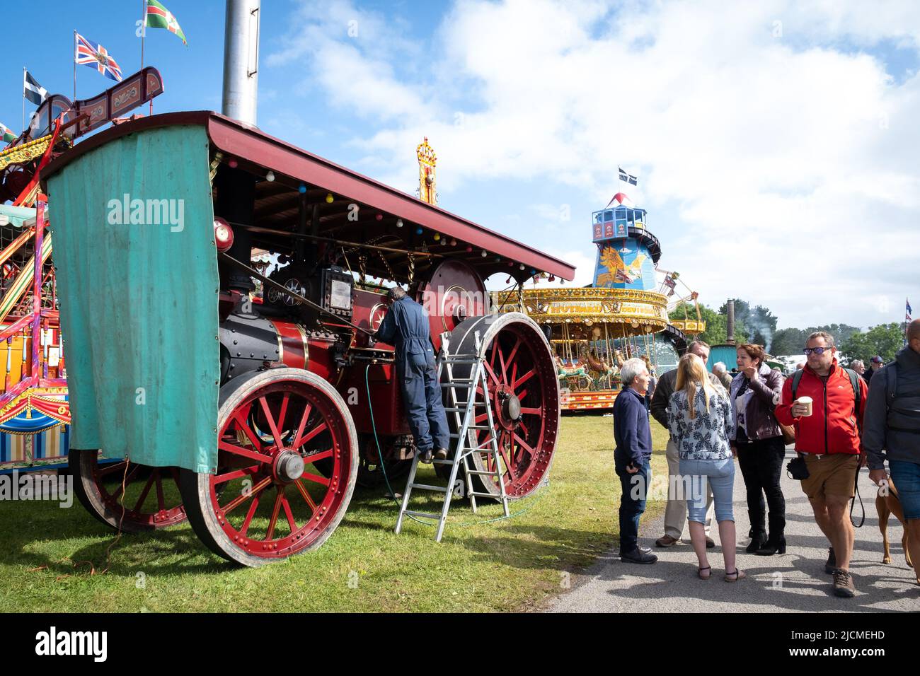 Dedicated owner at work on his traction engine. Lovingly restored and maintained. Great for being part of a community of owners and admirers. Stock Photo