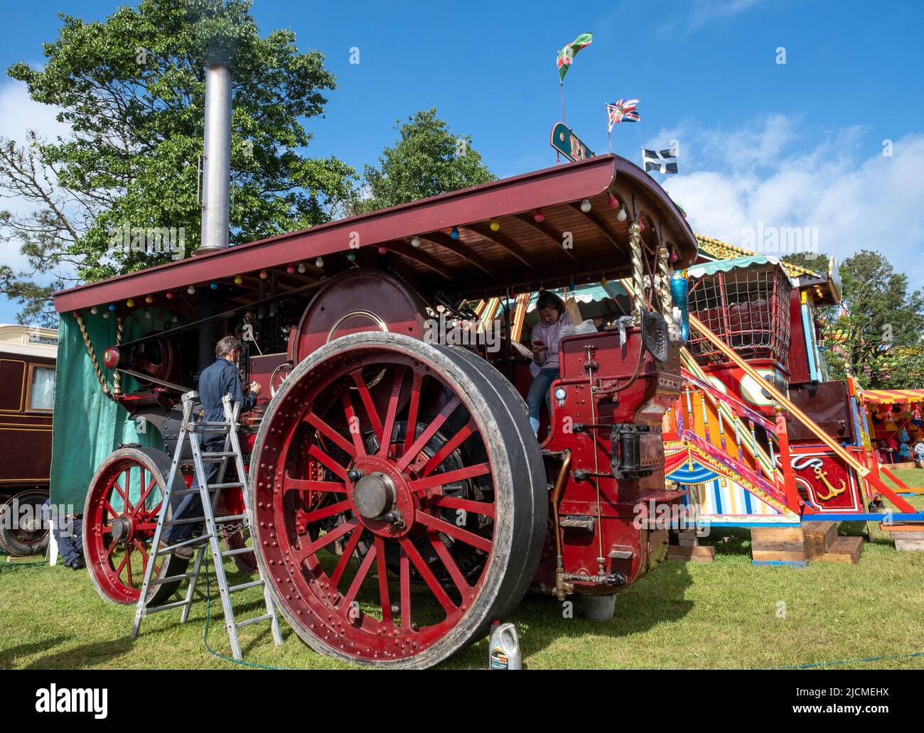 Dedicated owner at work on his traction engine. Lovingly restored and maintained. Great for being part of a community of owners and admirers. Stock Photo