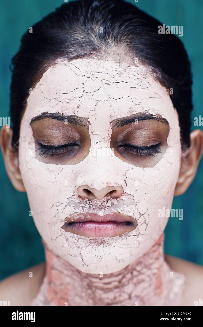 A young woman with a Pink Clay Face Mask. Stock Photo