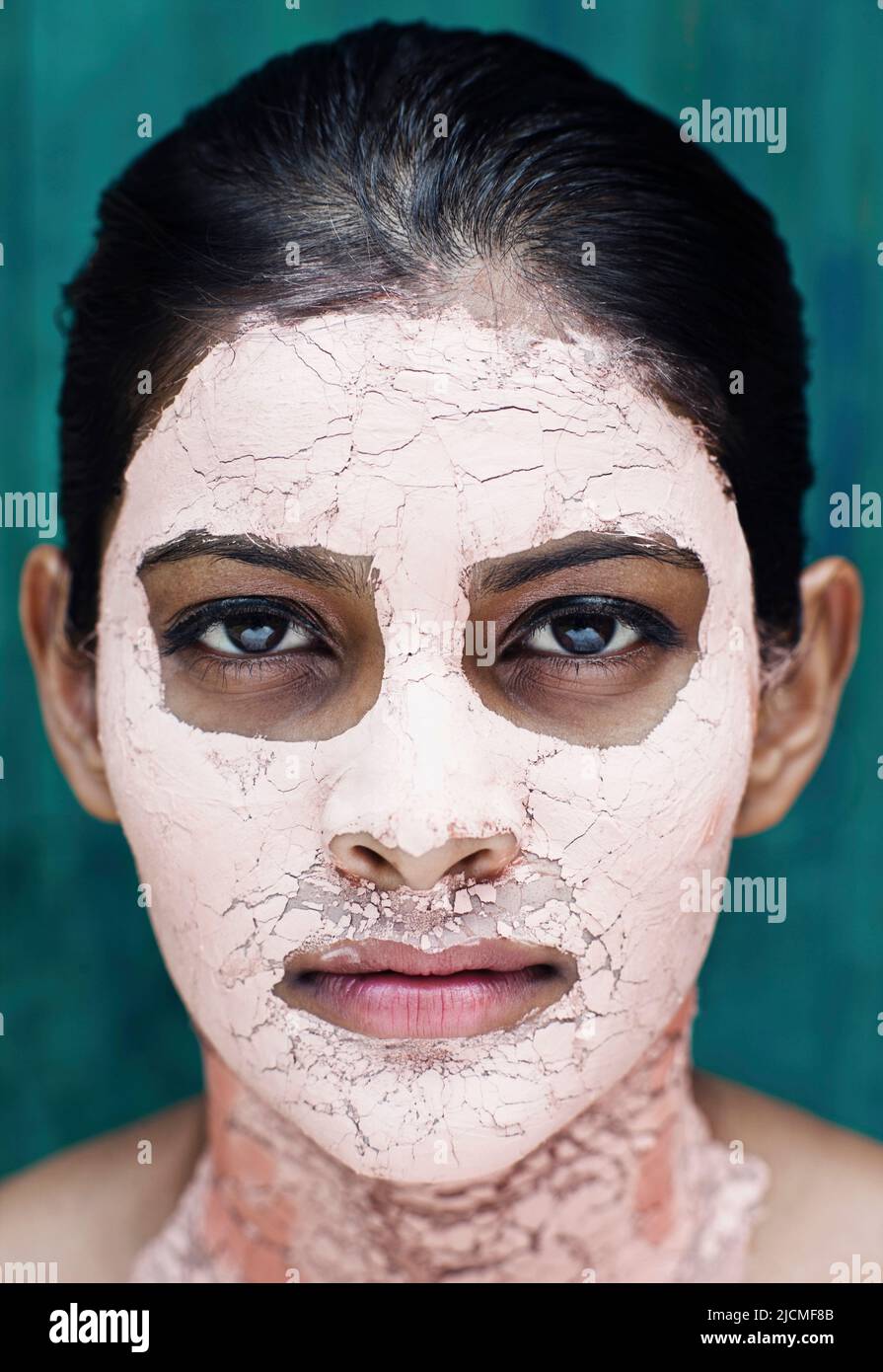A young woman with a Pink Clay Face Mask. Stock Photo