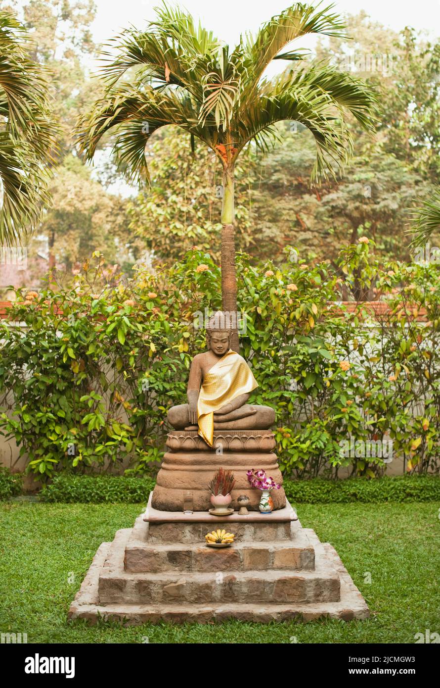Buddha statue in a resort garden. Siem Reap, Cambodia. Stock Photo