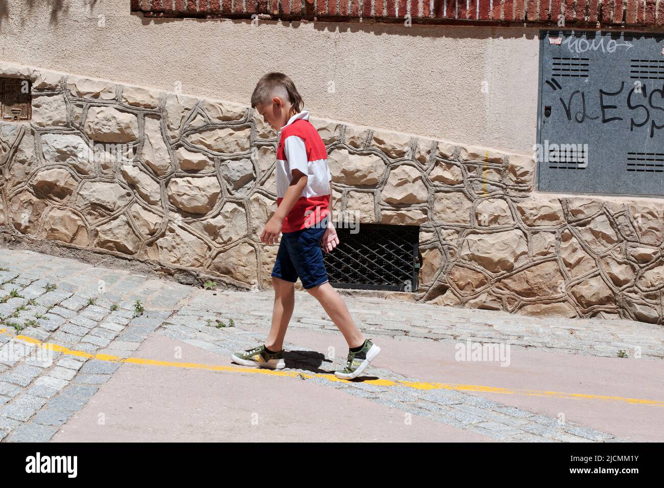 Boy with mullet, Alforja, Spain. Stock Photo