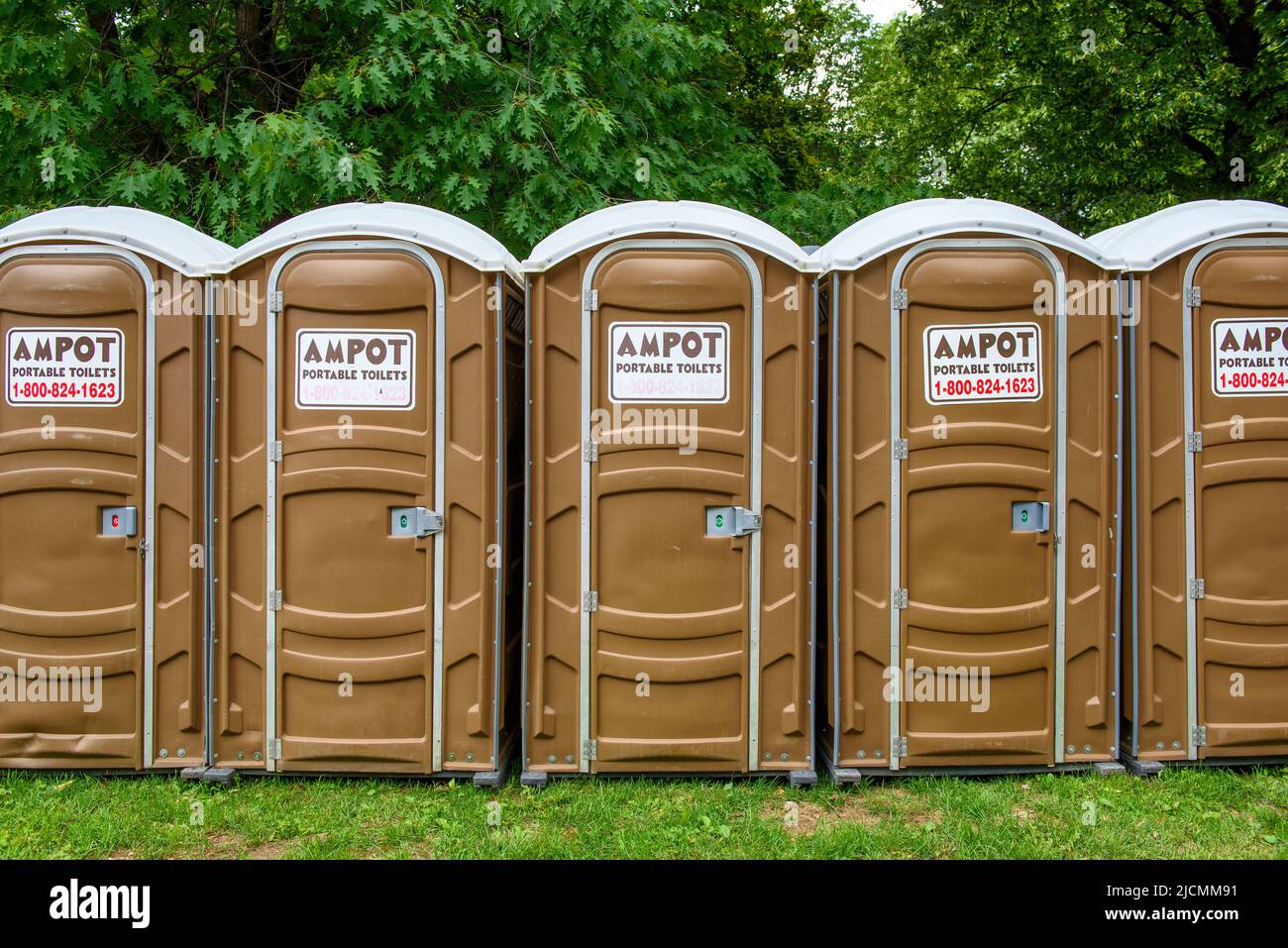 Front view of a group of Ampot Portable Toilets. The public washroom are servicing people attending Word On The Street Festival in the Queen's Park circ Stock Photo