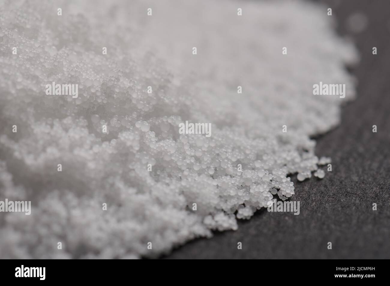 Polymer white balls pile macro close up side view Stock Photo