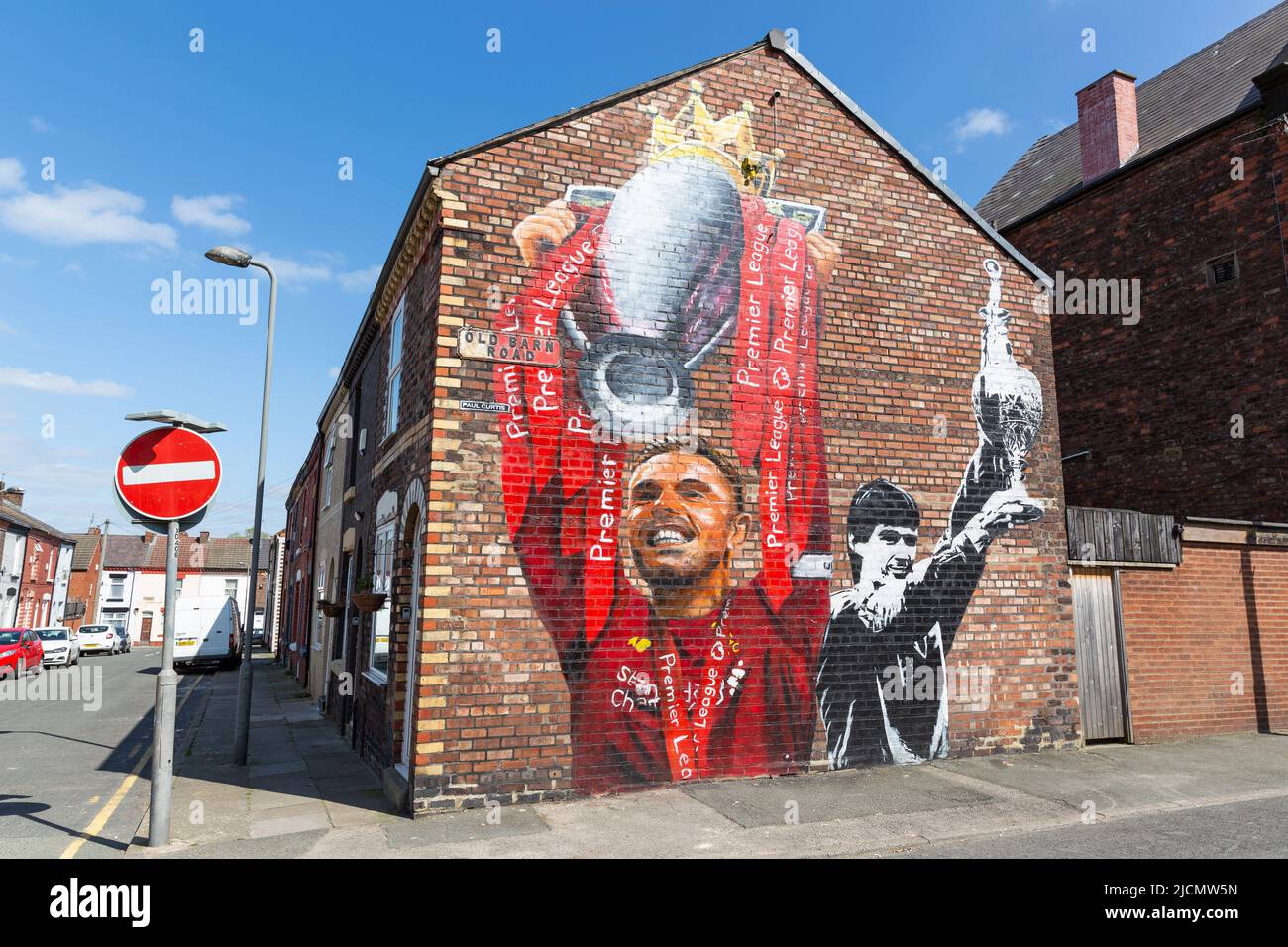 Mural of Jordan Henderson and Alan Hansen holding football league trophy, Liverpool FC street art, Anfield, Liverpool, England, UK Stock Photo