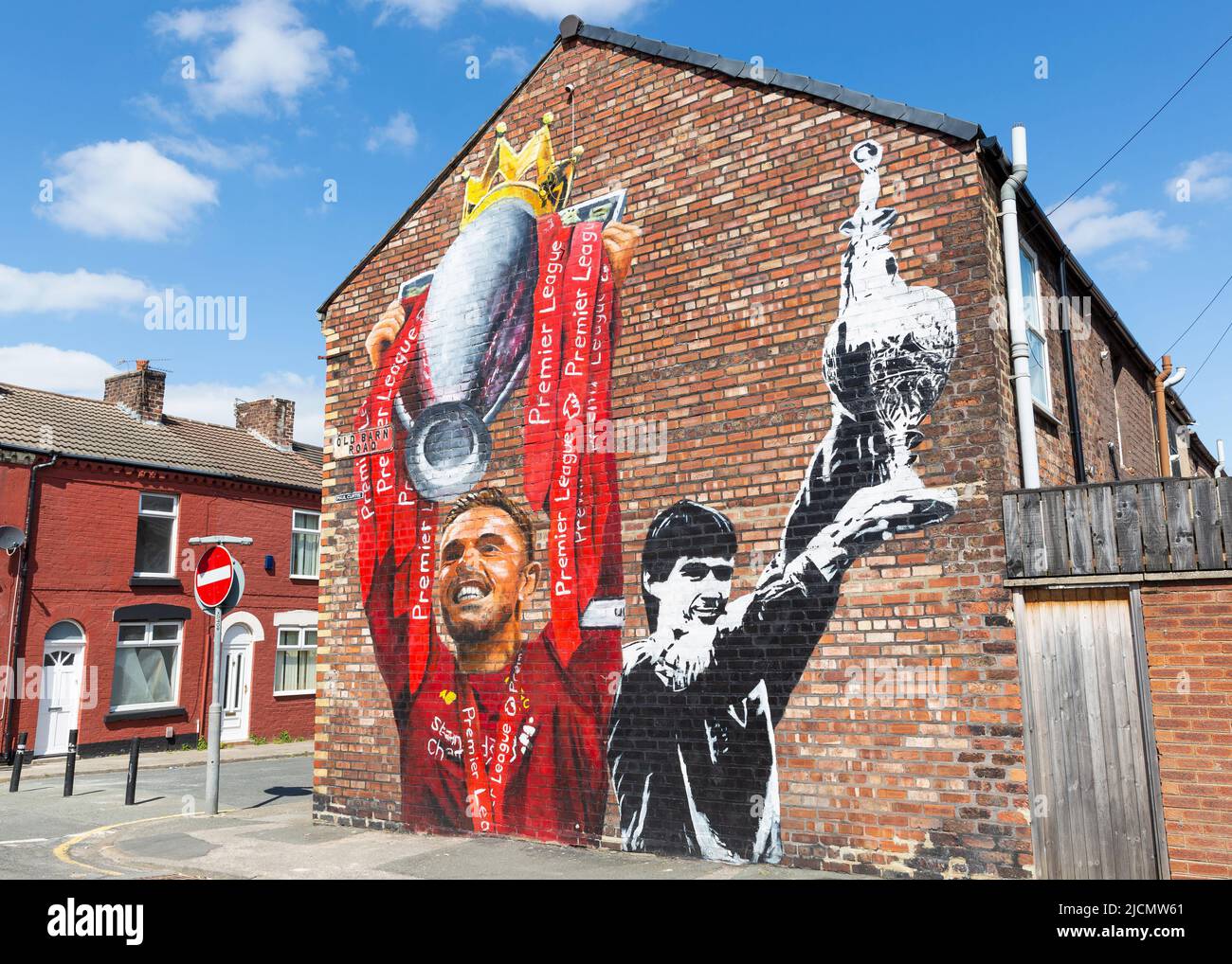 Mural of Jordan Henderson and Alan Hansen holding football league trophy, Liverpool FC street art, Anfield, Liverpool, England, UK Stock Photo