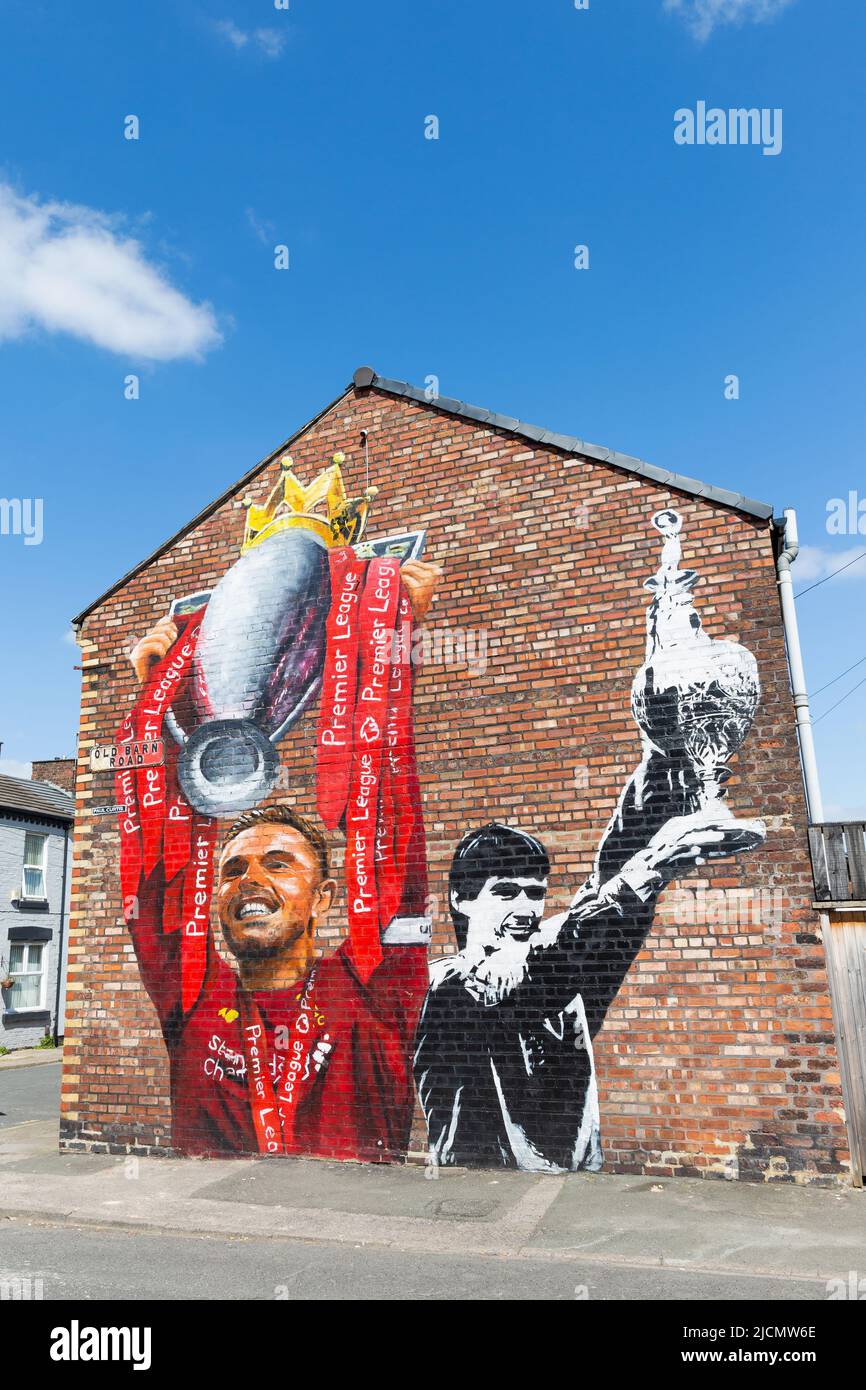 Mural of Jordan Henderson and Alan Hansen holding football league trophy, Liverpool FC street art, Anfield, Liverpool, England, UK Stock Photo