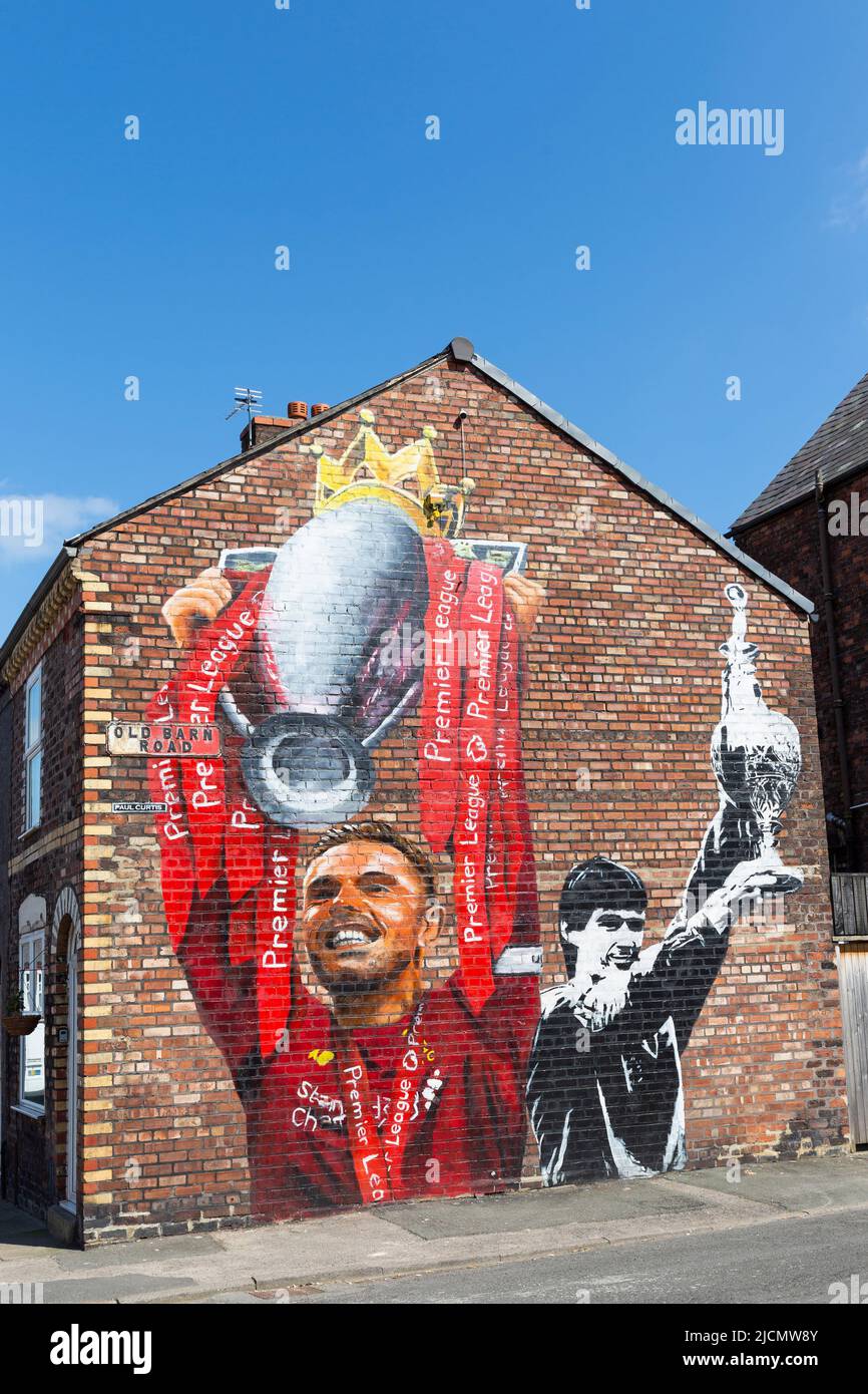 Mural of Jordan Henderson and Alan Hansen holding football league trophy, Liverpool FC street art, Anfield, Liverpool, England, UK Stock Photo