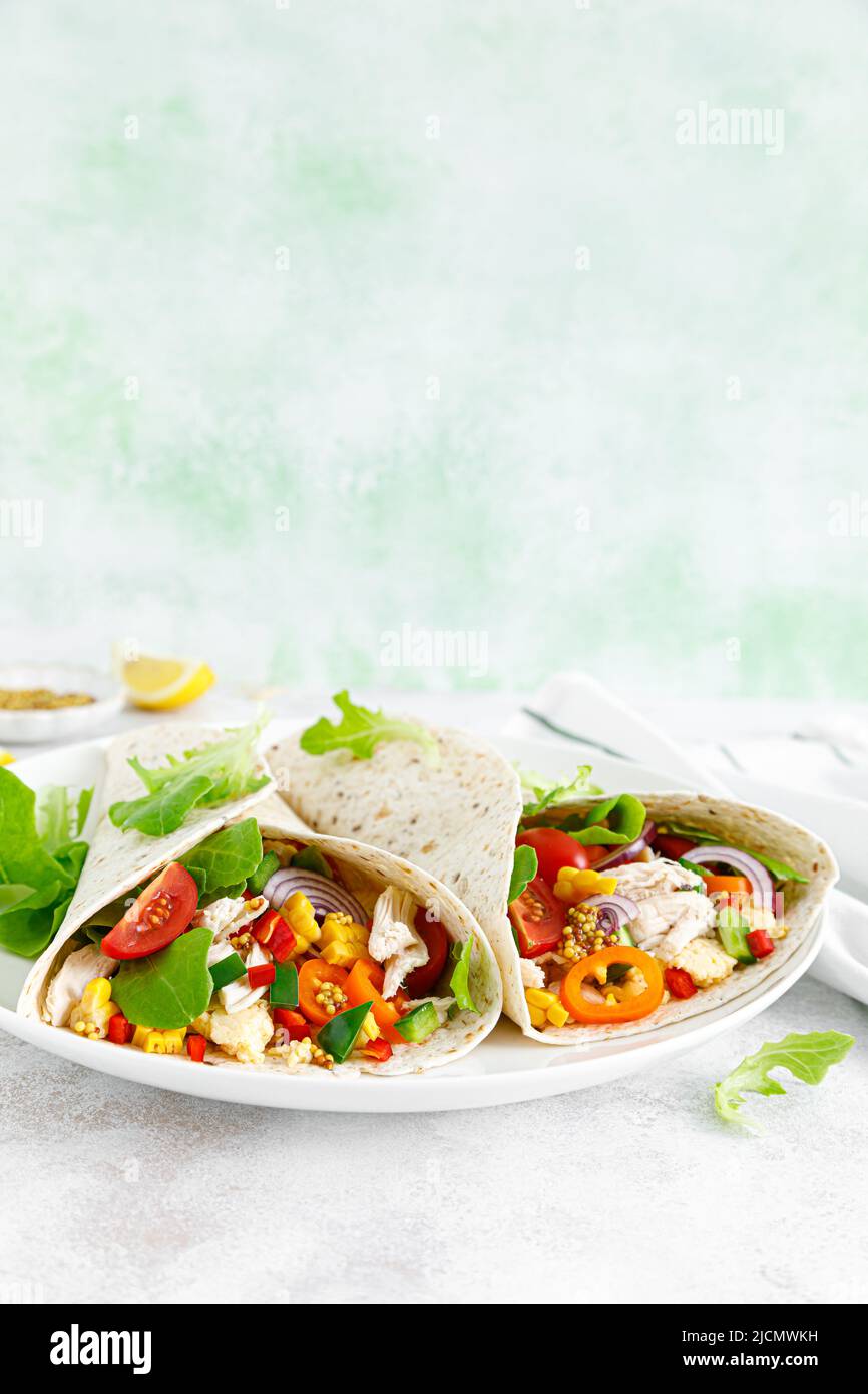 Mexican tacos with chicken meat and vegetables Stock Photo