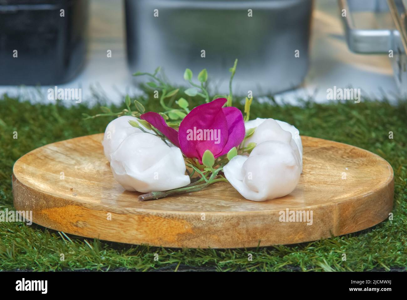 Asian stuffed dumplings offered for sale at the farmers street food market in Prague. Stock Photo