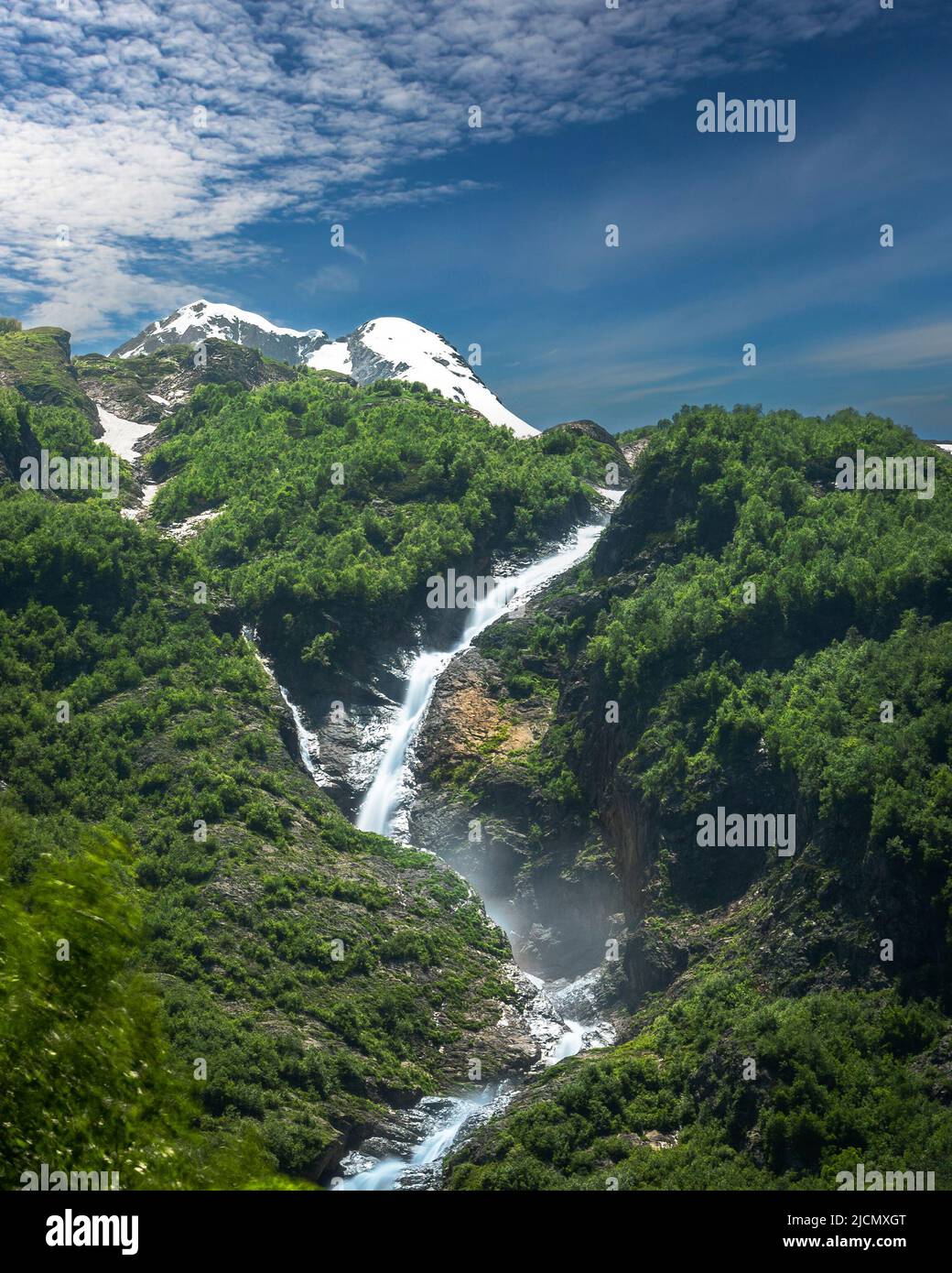High waterfall in mountain forest hi-res stock photography and images ...