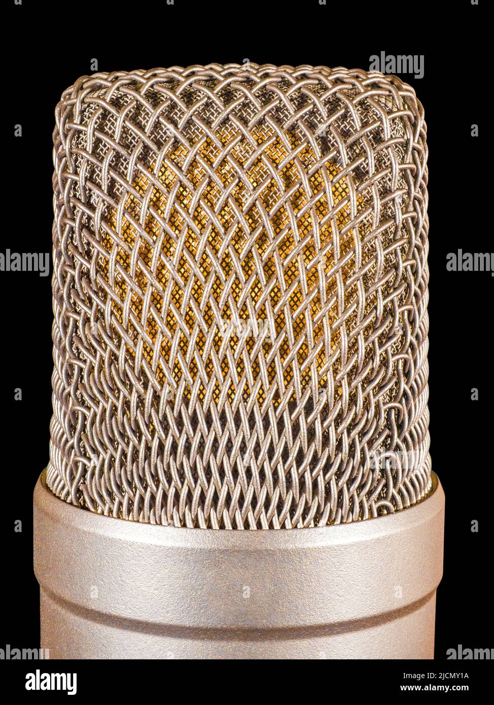 Large capsule of gold condenser microphone isolated on black Stock Photo