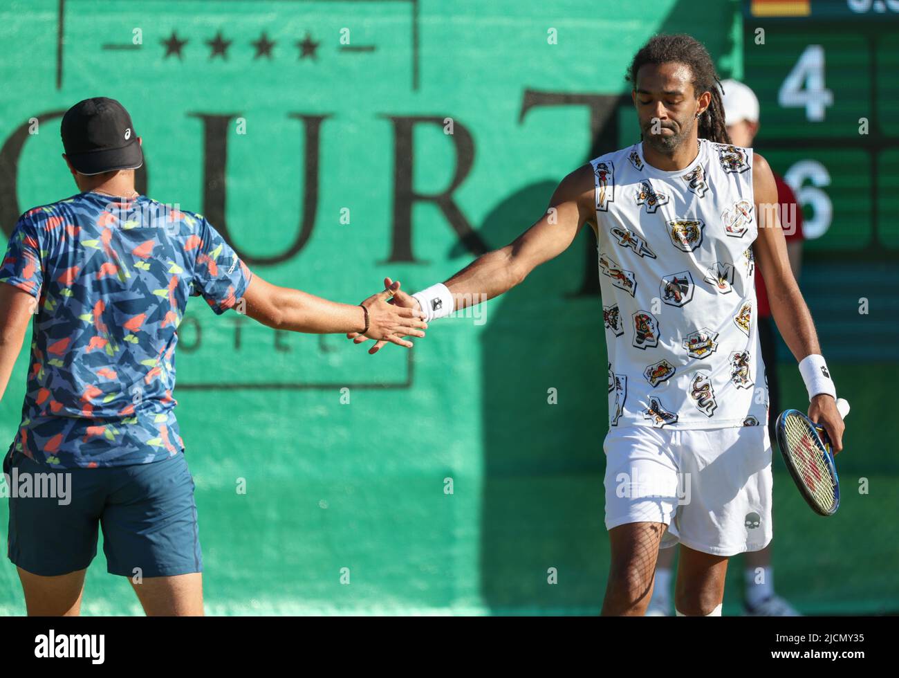 Halle, Germany. 14th June, 2022. Tennis: ATP Tour doubles, men, 1st round,  Hanfmann and Struff (Germany) - Stricker and Brown (Switzerland/Jamaica). Dustin  Brown (l) and Dominic Stricker are on the court. Credit