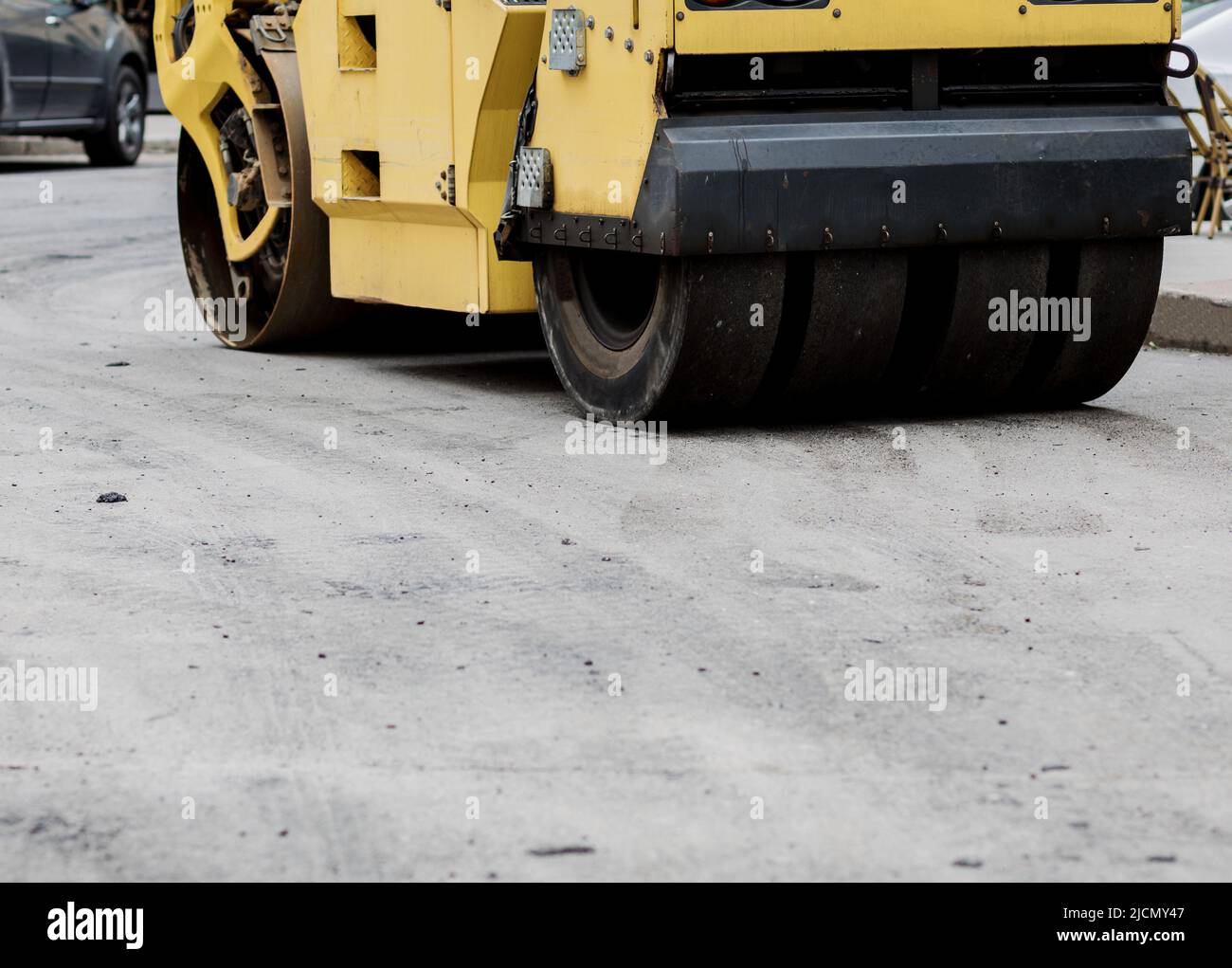 Road roller flattening new asphalt. Heavy vibration roller Stock Photo