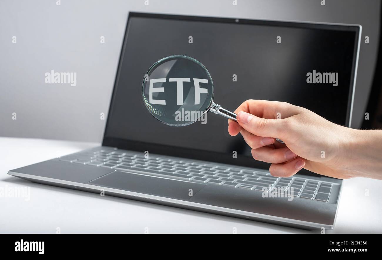 ETF index, acronym through magnifying glass. photo Stock Photo