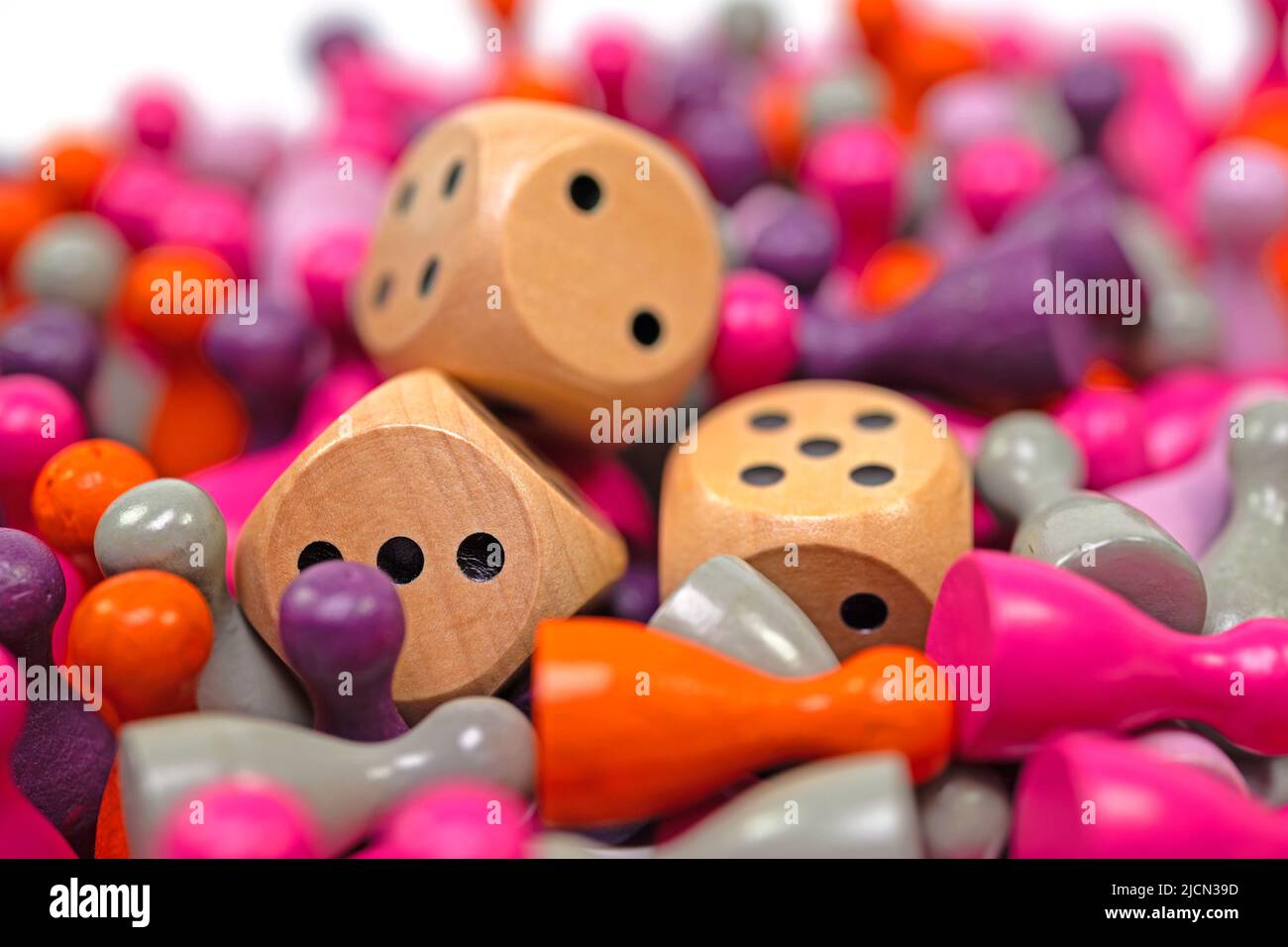 Lots of colorful game pieces and dice for board games Stock Photo Alamy