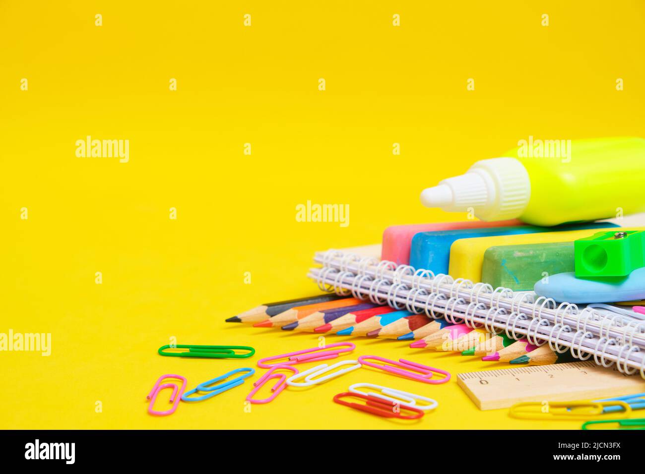 school-supplies-yellow-background-preparing-child-for-school-stock