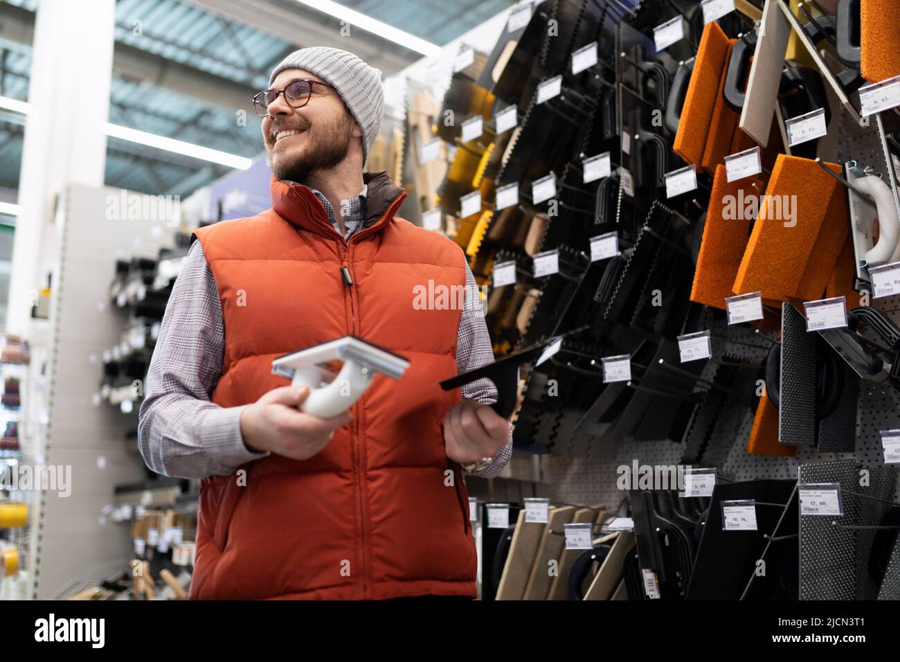 the buyer chooses tools for plastering work in a building 