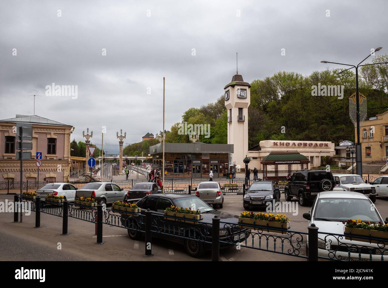 Kislovodsk, Russia - May 08, 2022: Railway station and station square with car parking and public transport stop Stock Photo