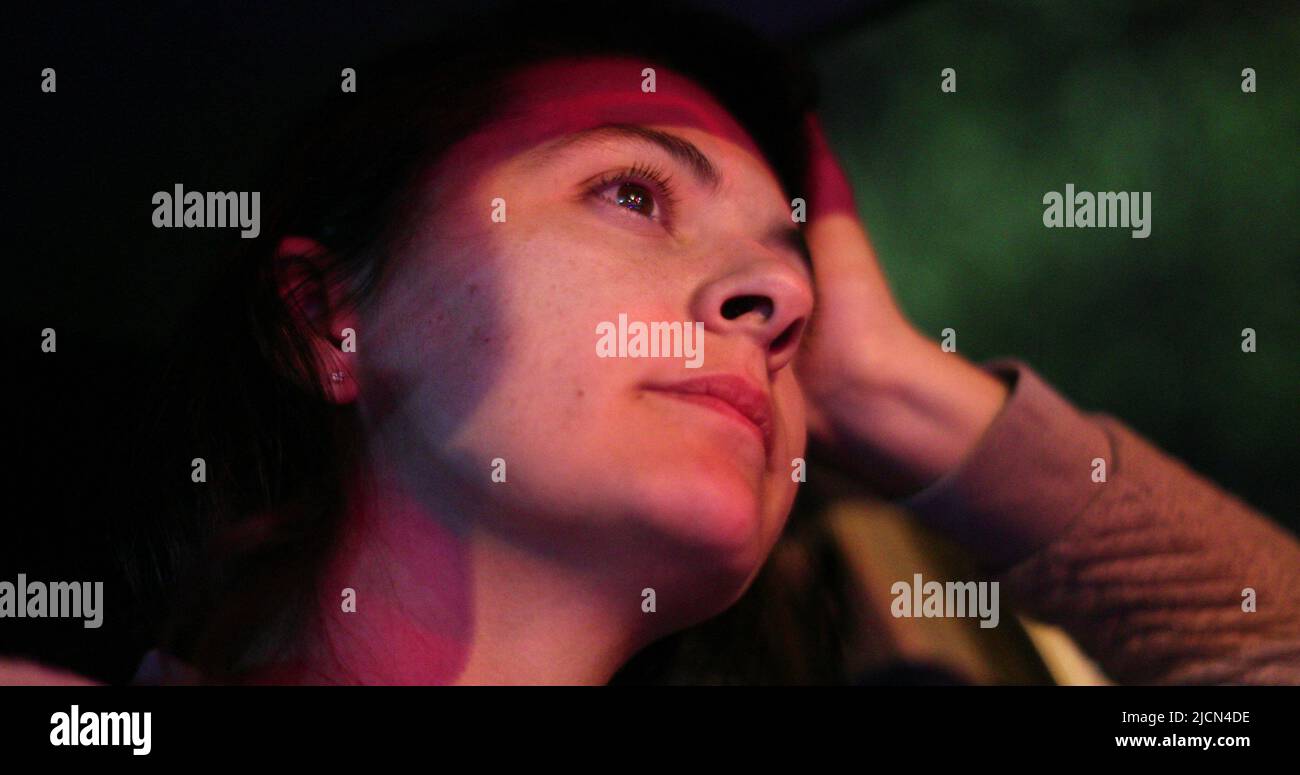 Woman driver stuck in traffic at red light. Female driver getting a