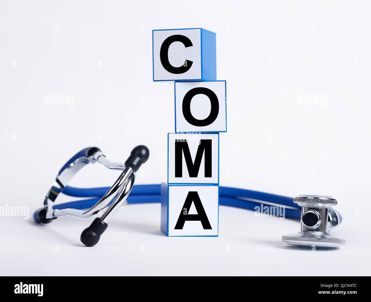 Coma word on medical cubes on white background. Stock Photo
