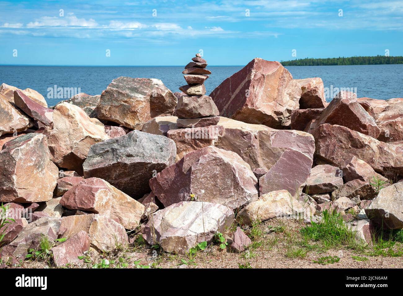 Crimson quartzite stones on the shore of Lake Onega. Karelia, Russia Stock Photo