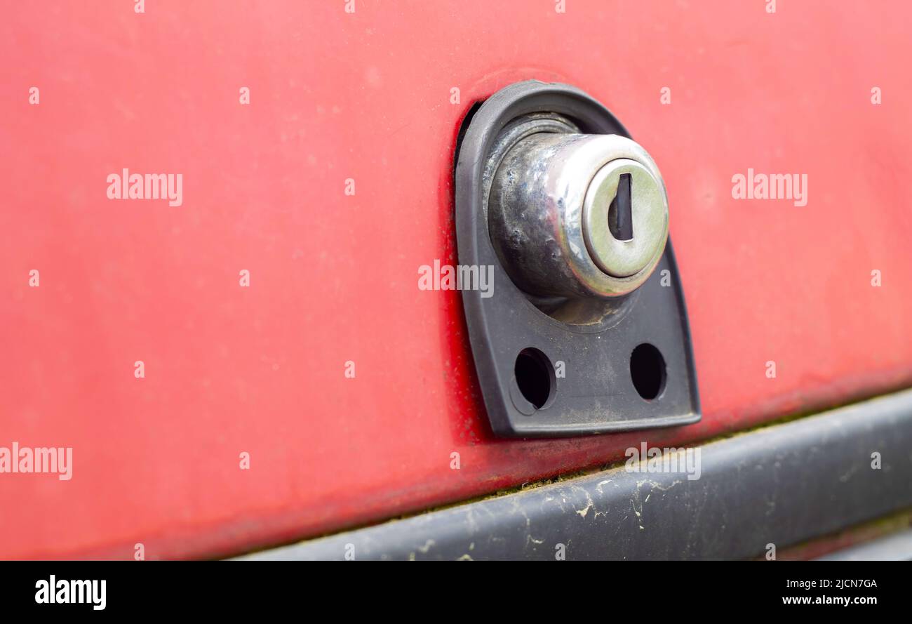 Old car trunk lock. Trunk lock details. Closeup of a handle to open